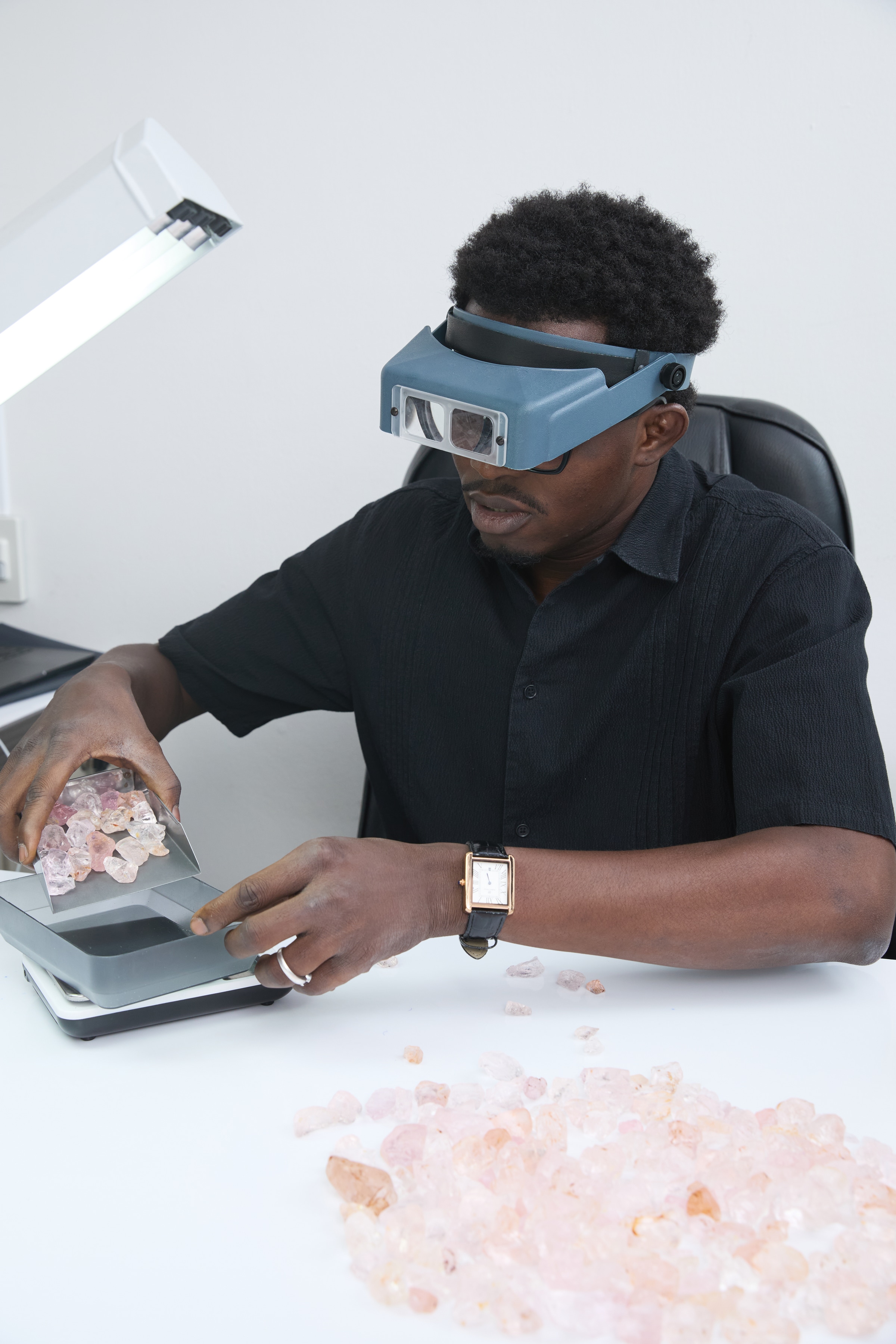 Founder inspecting a gemstone